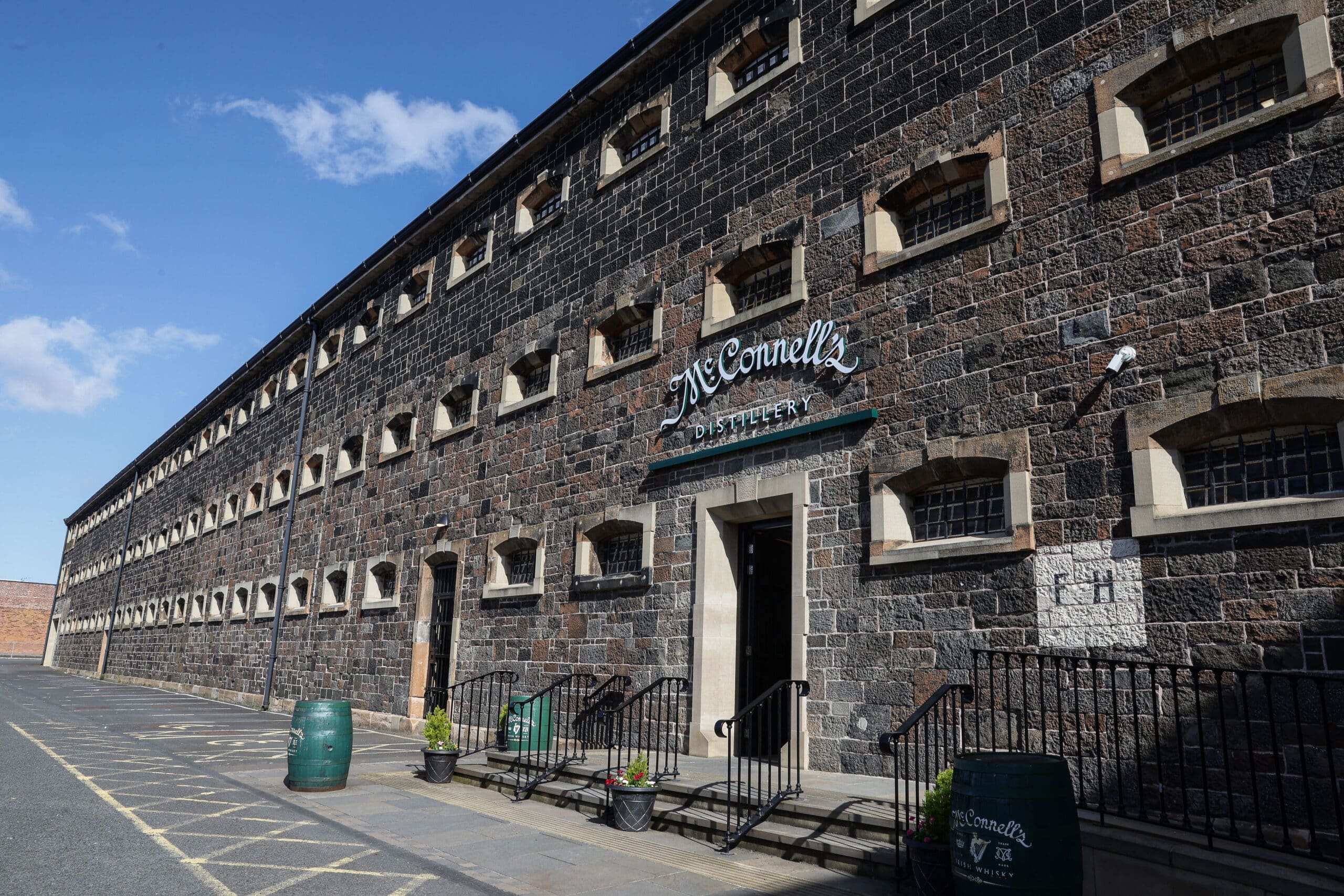 Photo outside McConnell's Distillery showing signage and blue skies