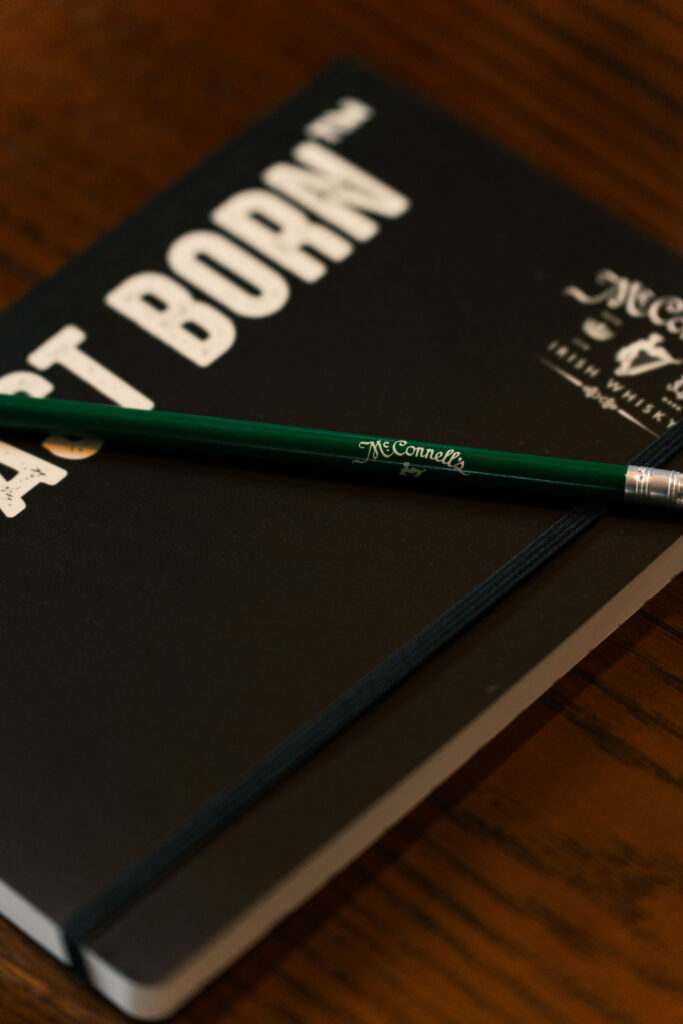 A McConnell's notebook and pencil close up